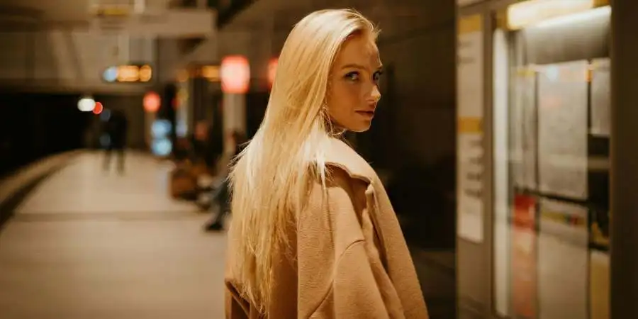 Blonde Woman Walking on a Train Station