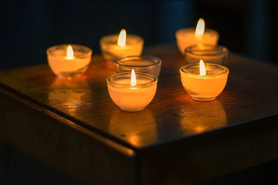 Candles burning in glass jars