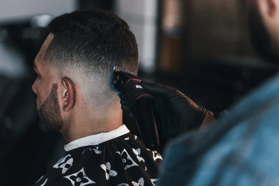 Close Up Of Barber Giving A Fade