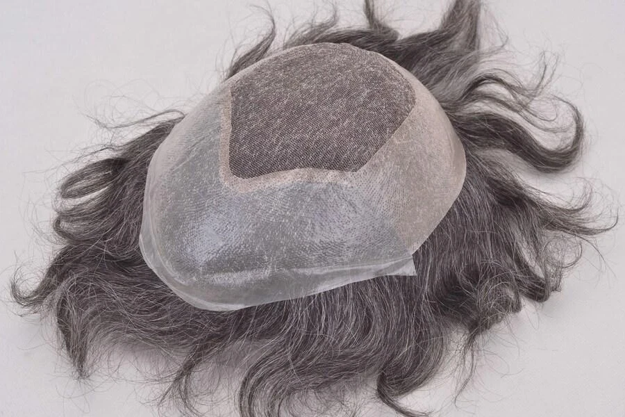 Close-up of a toupee on a gray background