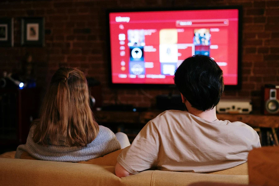 Couple sitting on the sofa watching TV