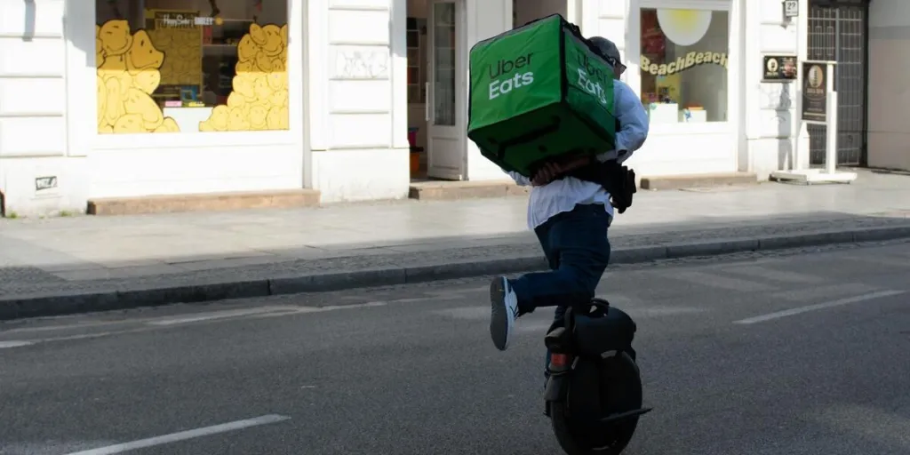 Delivery man using a unicycle