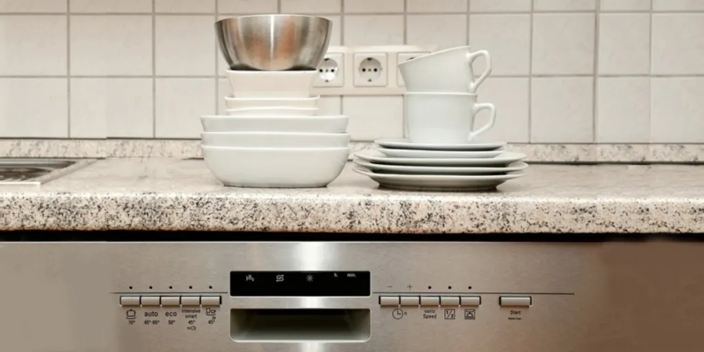 Dishes on a countertop above dishwasher