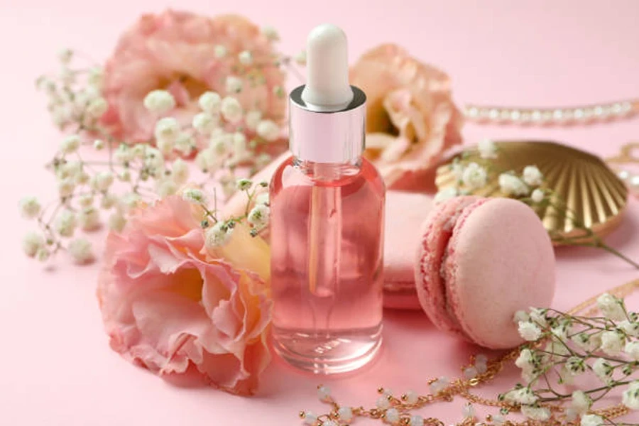 Female Accessories and Macaroons on Pink Background