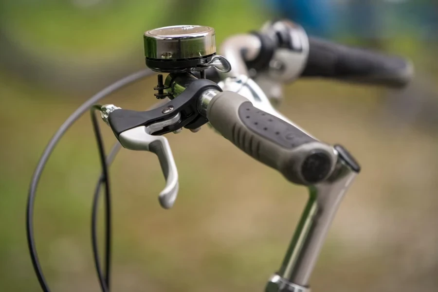 Good quality bell on handle of silver and black bike