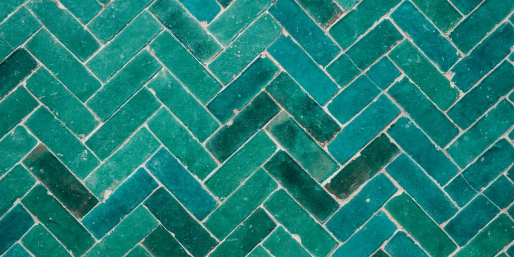 Green tiles in a herringbone pattern