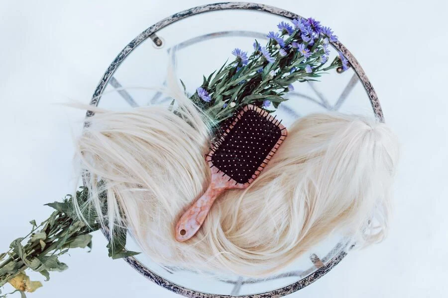 Hair brush on a white a white wig