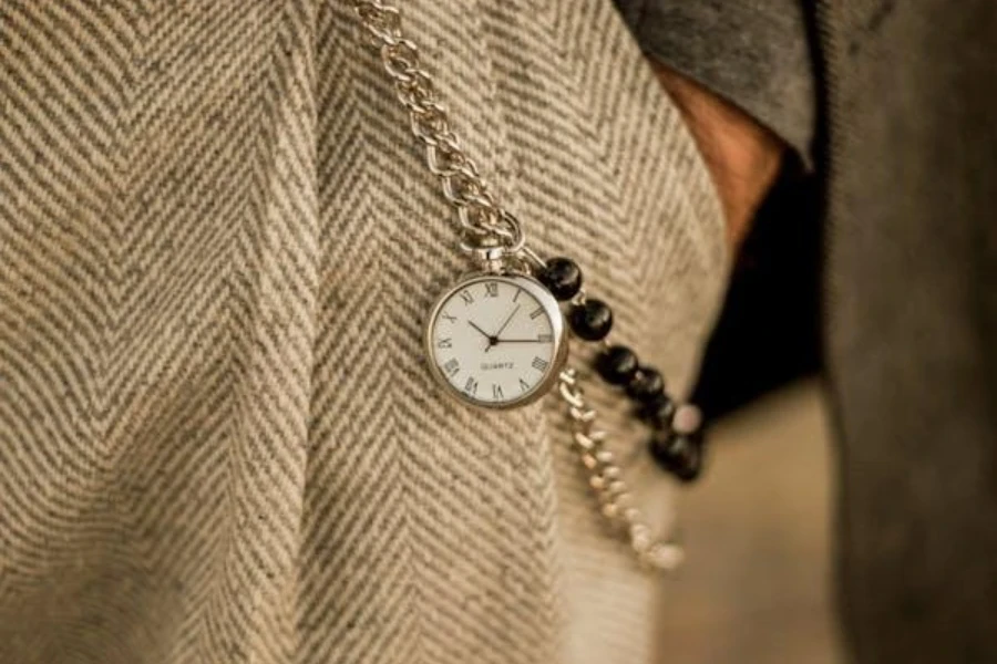 Herringbone tweed trousers with a watch