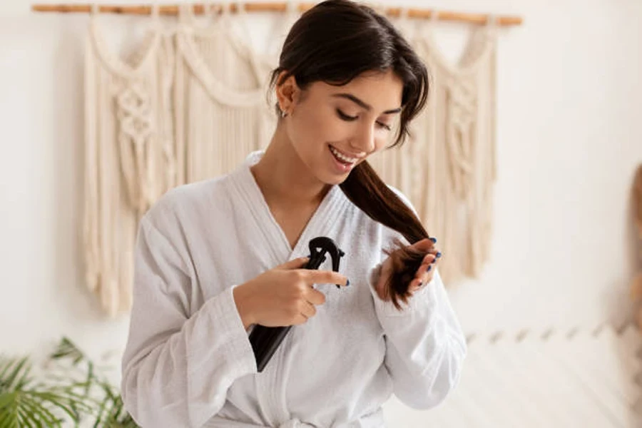 Lady Spraying Hair Caring for Split Ends