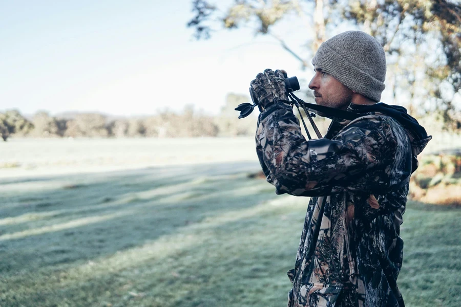 Man Holding Binoculars