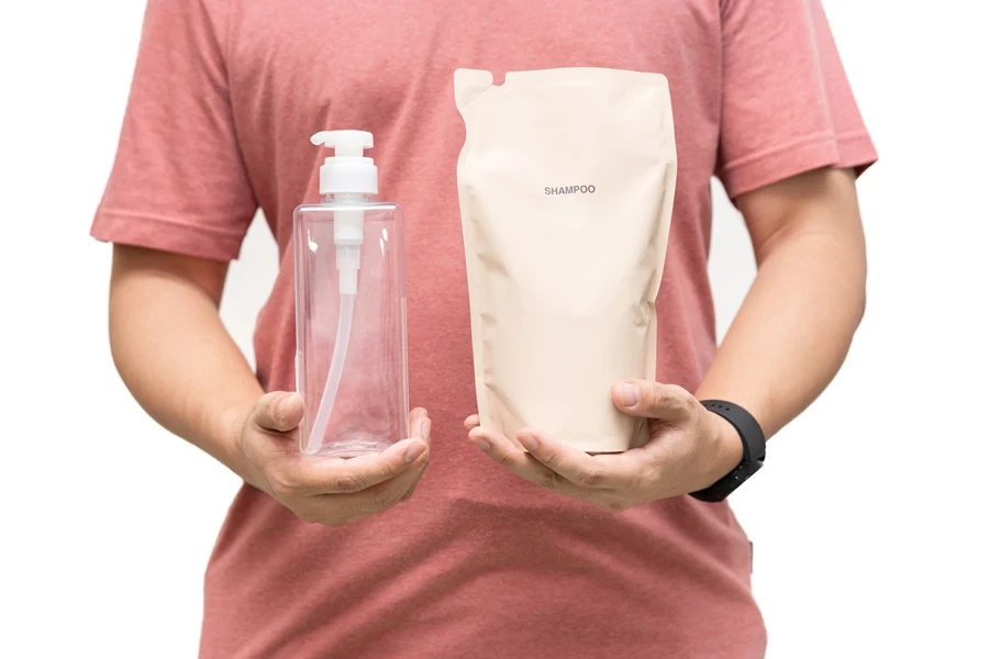 Man holding a transparent bottle and powder shampoo