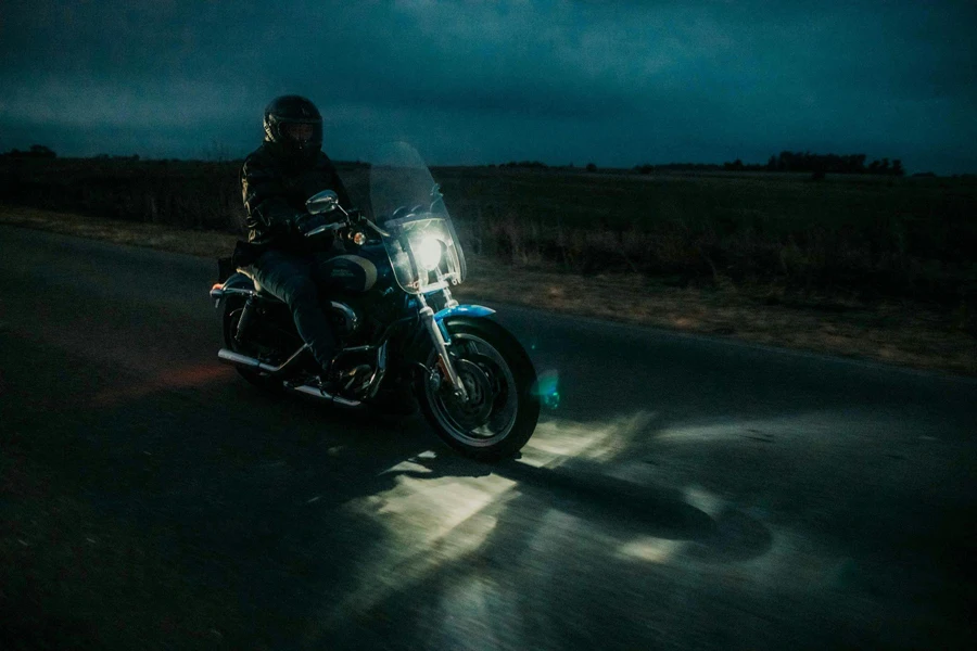 Man riding motorbike in the dark