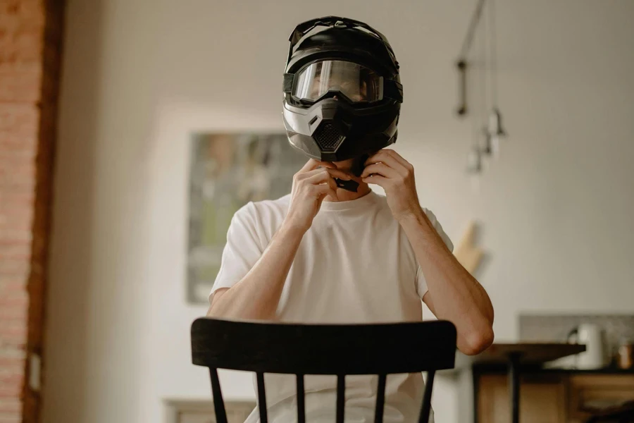 Man trying motorcycle helmet