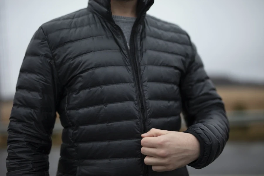 Man wearing black polyester coat