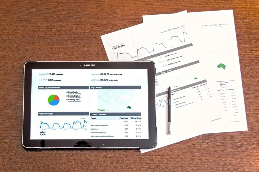 Marketing reports on a tablet and papers