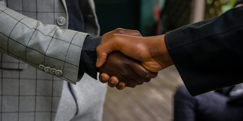 Men in suit jackets closing a deal