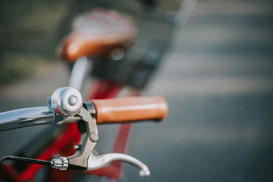 Steel bicycle bell attached to stainless steel round handlebars