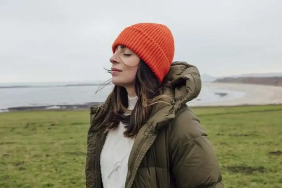 Woman Standing with Her Eyes Closed