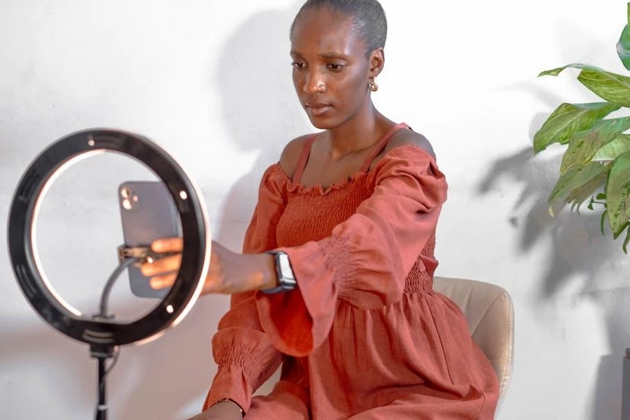 Woman creating content with a ring light and phone