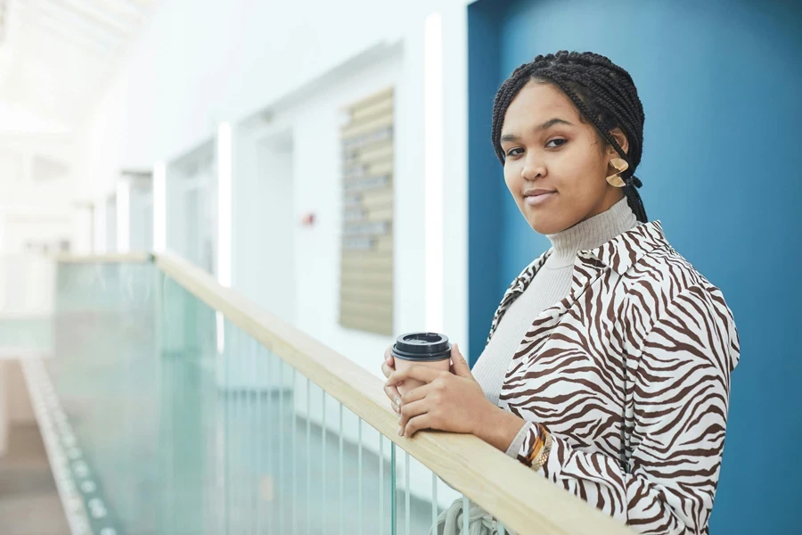 Woman in brown zebra print collared shirt