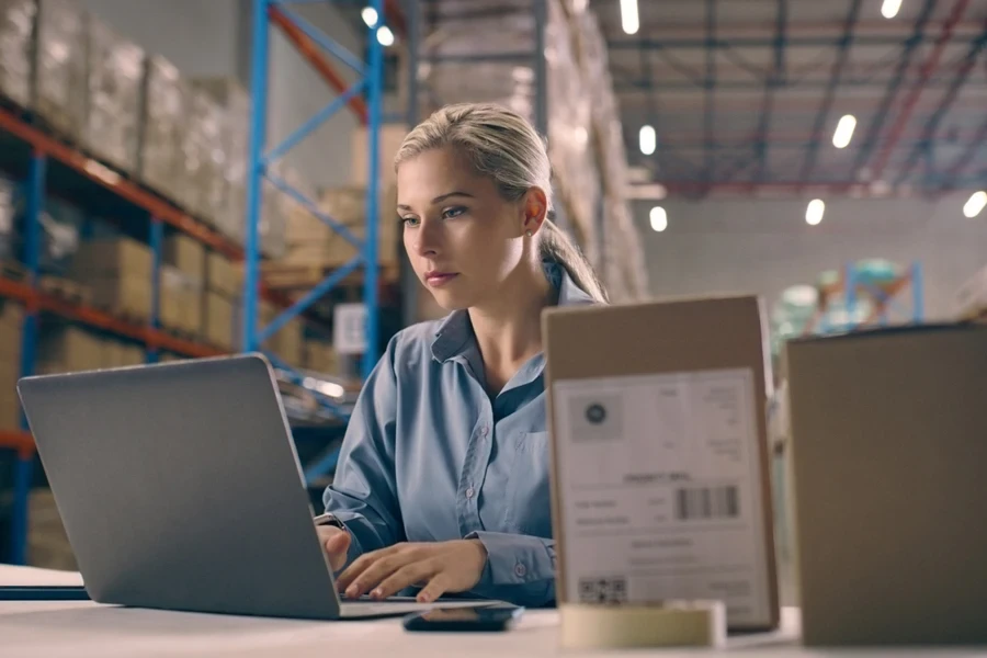 Woman managing shipments in a warehouse