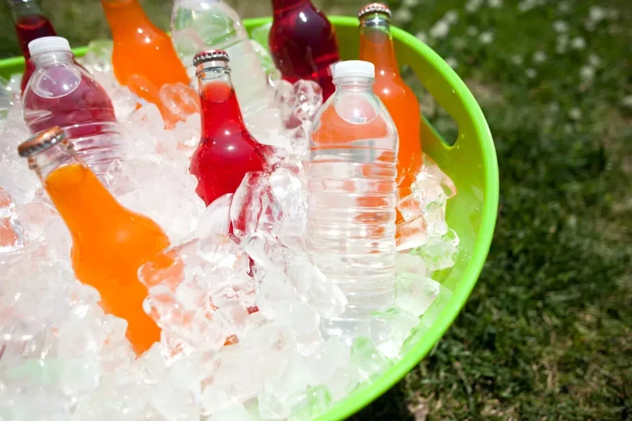 A green beverage tub with many drinks