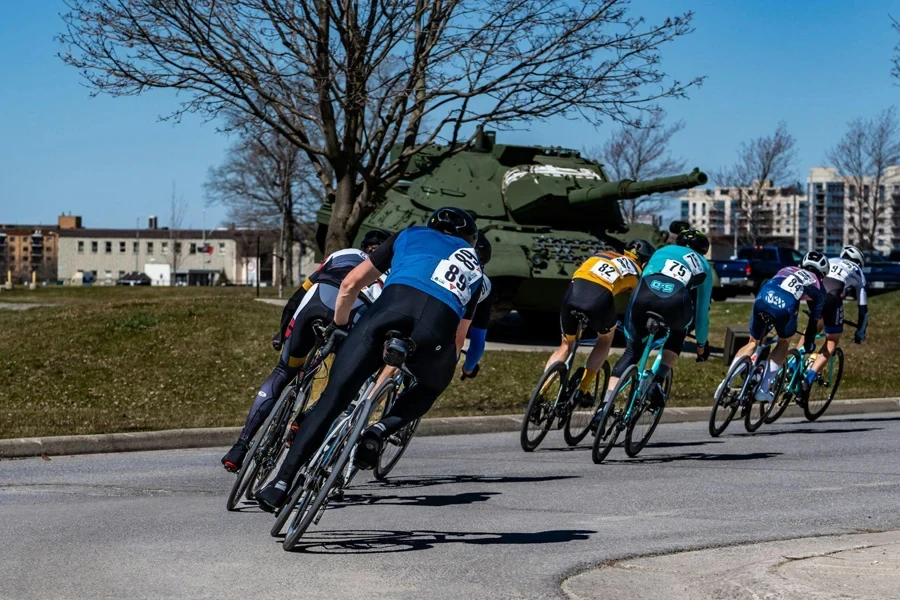 a group of people riding bikes down a street