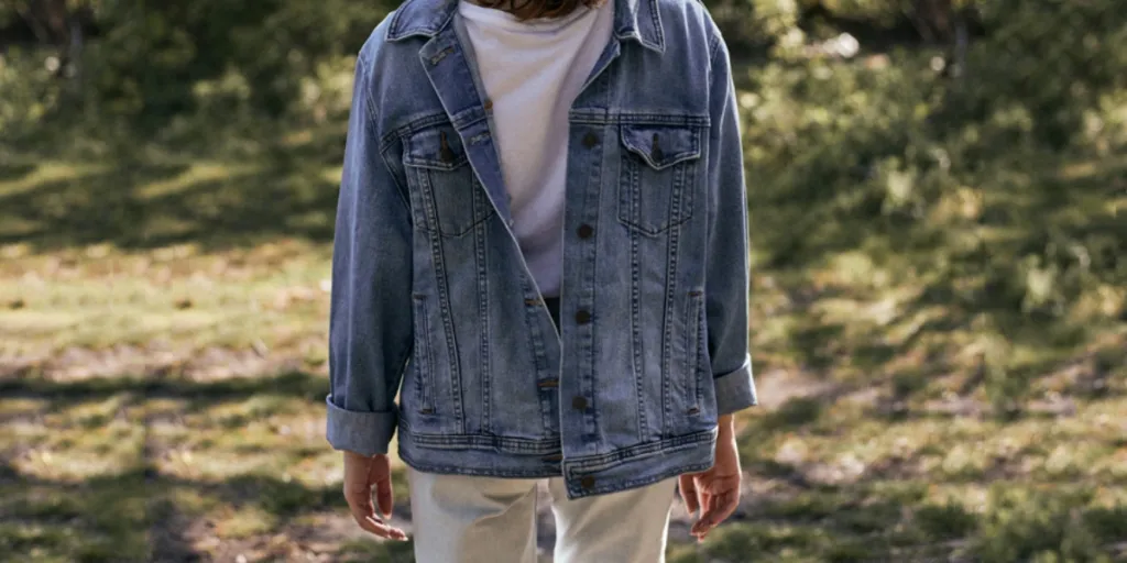 a guy wearing men’s denim trends for 2025