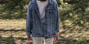 a guy wearing men’s denim trends for 2025