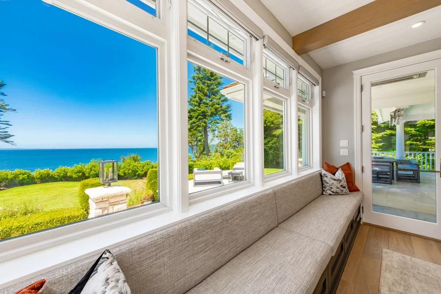 a long banquette seating under a window