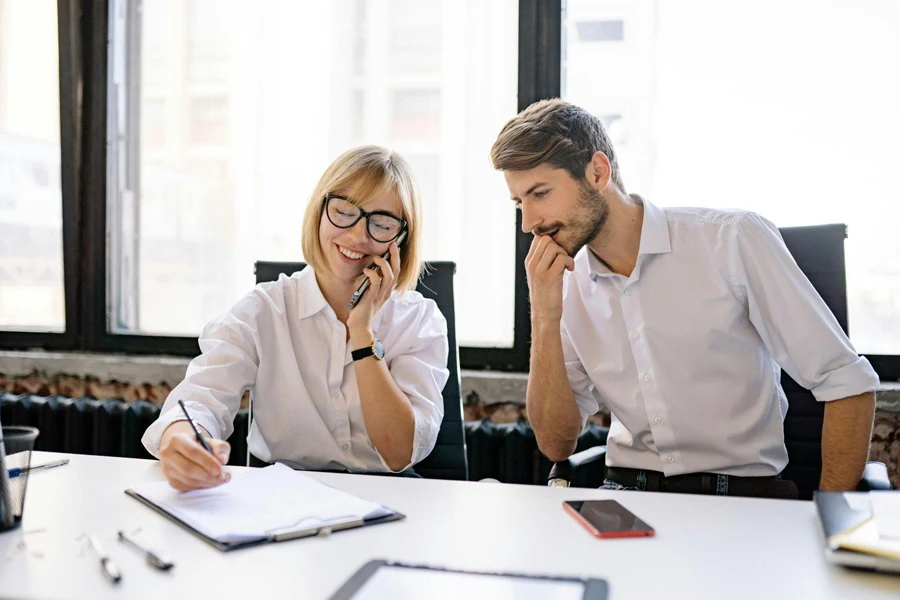 a woman and man having a sales call