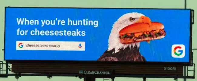 billboard that includes a google search for cheesesteaks