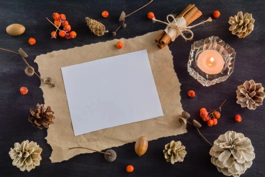 candles with pinecones and candle holders on dark background