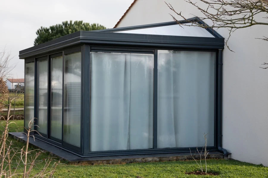 prefabricated sunroom attached to a house