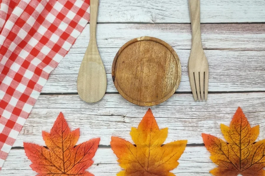 red-and-white checkered table cloth with autumn leaves