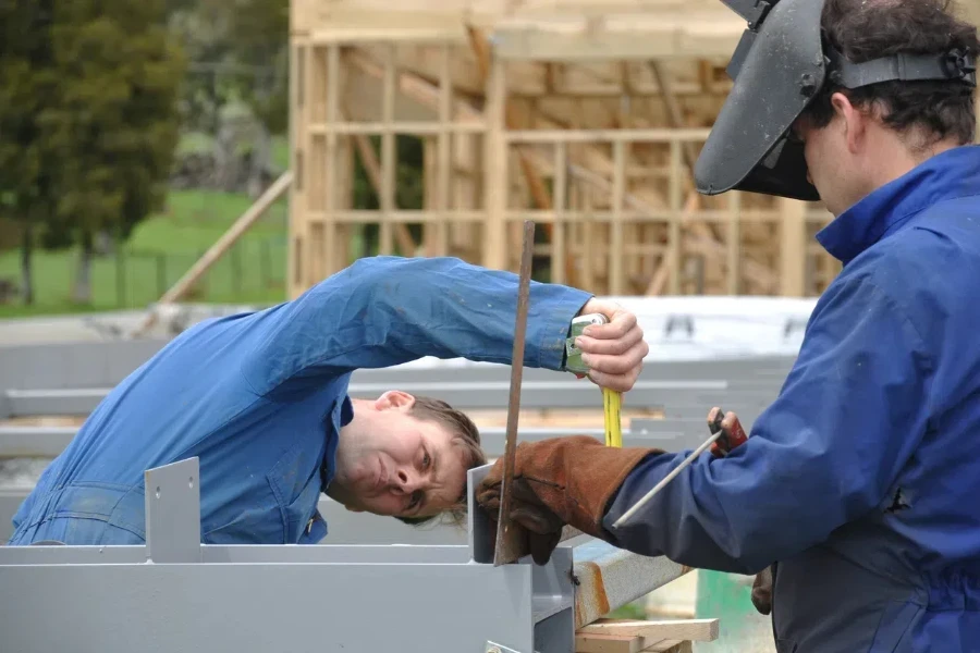 Workers using a MIG welder