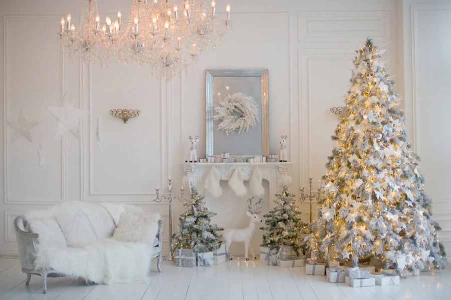 A beautiful white Christmas tree with white and gold decorations