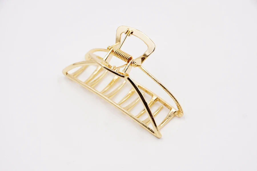 A big gold metal claw clip