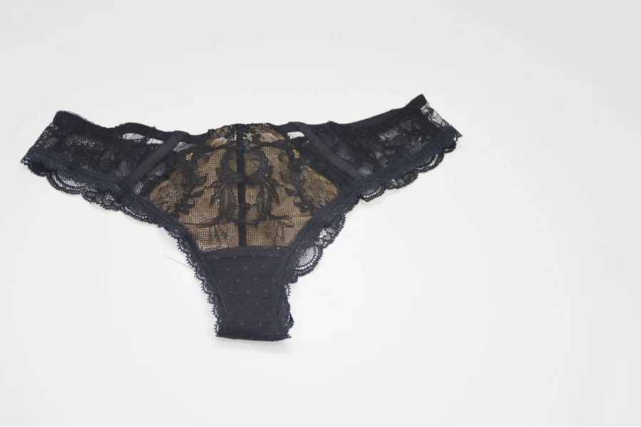 A black lace thong on a white background