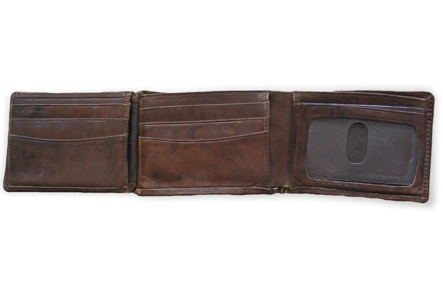 A brown leather tri-fold wallet on a white background