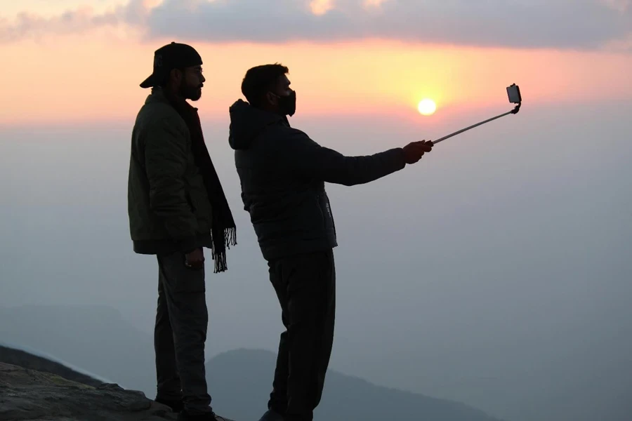 A couple of men taking a selfie