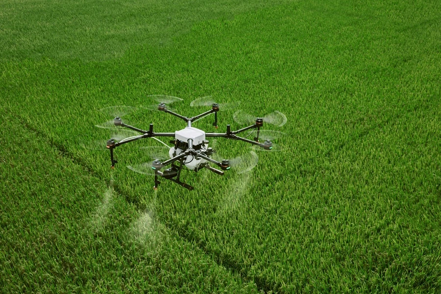 A drone flying in a grassy field