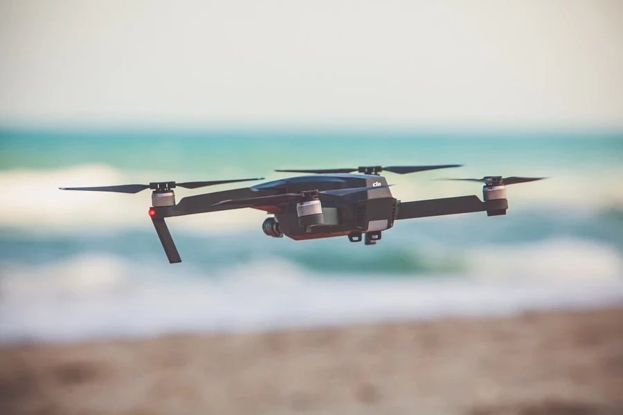 A drone flying over the beach