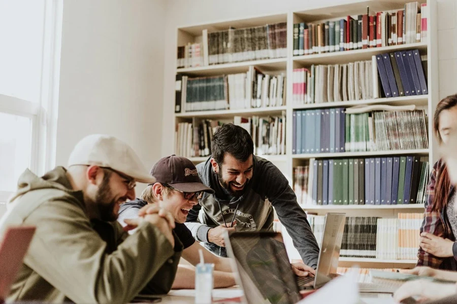 A group of people looking at a computer