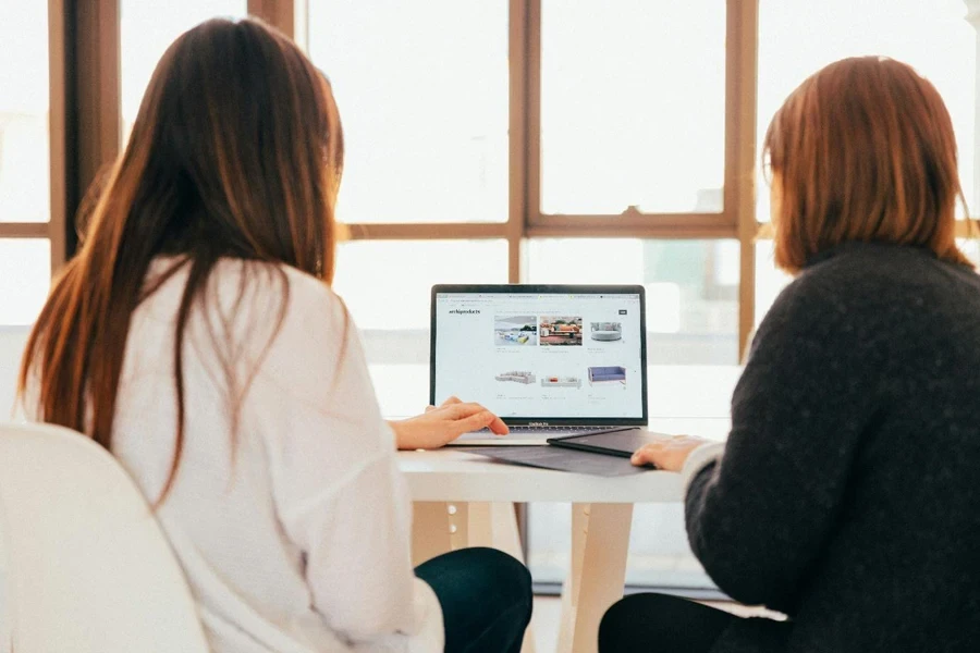 A group of women looking at a computer