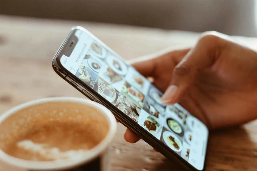 A hand holding a cell phone