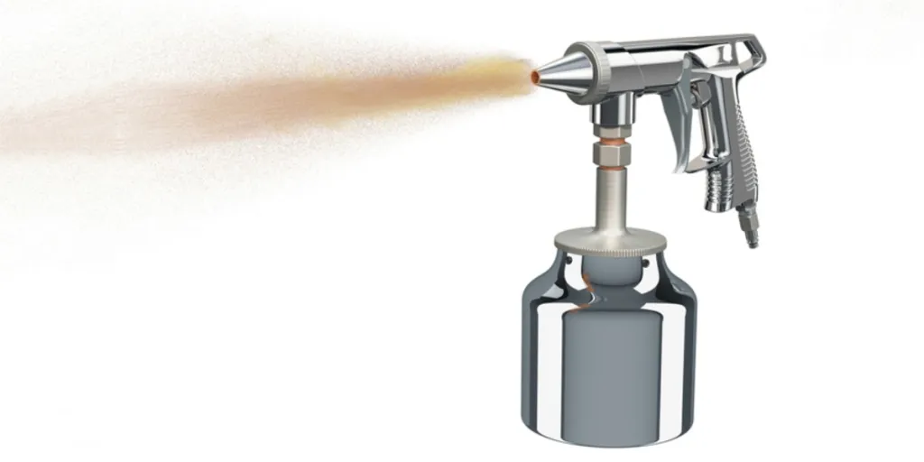 A handheld sandblaster on a white background