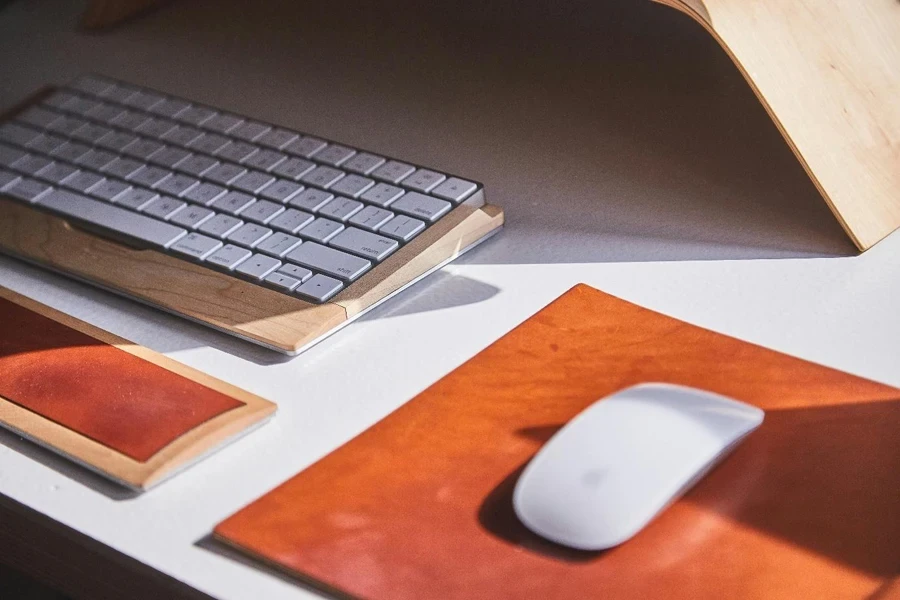 A keyboard and mouse on a mousepad