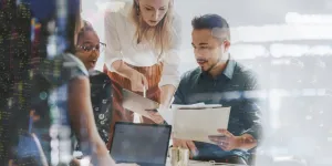 A marketing team working with a digital tablet