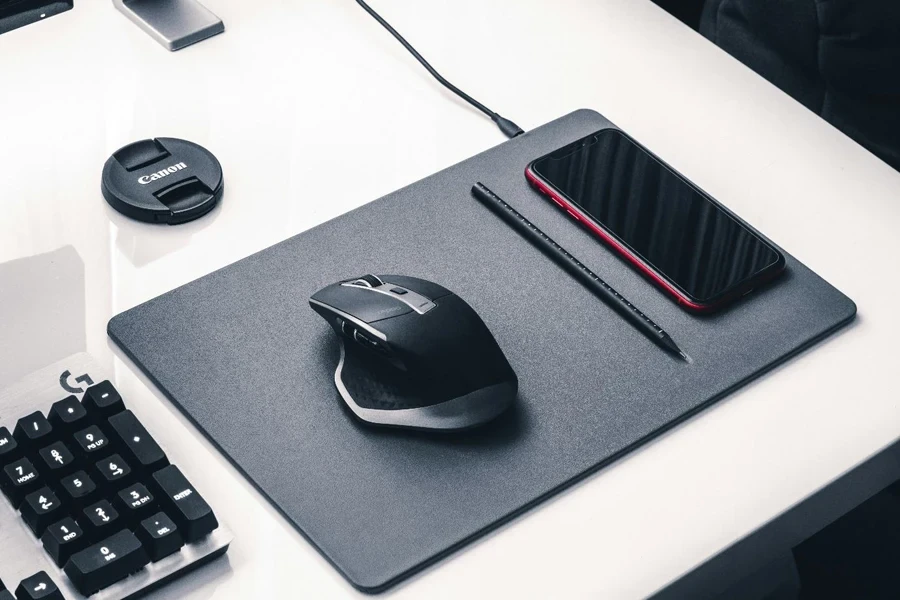 A mouse and a phone on a mouse pad